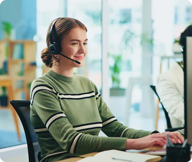 Support specialist on a headset helping a customer after launch